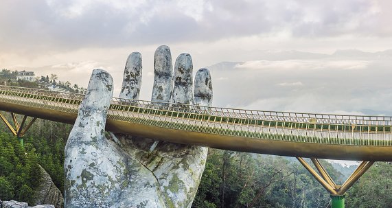 Da Nang, Vietnam, 28 december 2020: Famous tourist attraction - Golden bridge at the top of the Ba Na Hills, Vietnam.