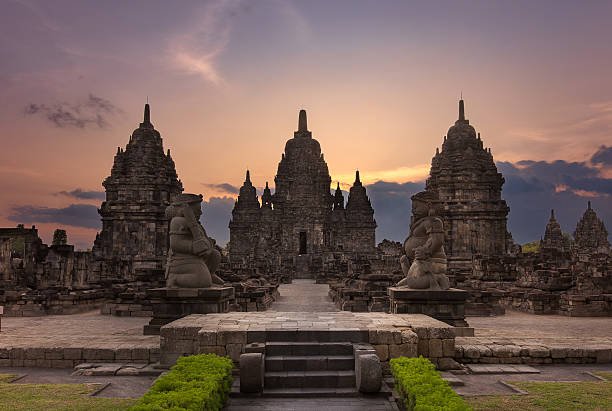 Majestic view of Sewu Temple, an 8th-century Mahayana Buddhist complex in Central Java, Indonesia, captured at sunset.
The ancient stone architecture, guardian statues and dramatic sky create a serene and timeless atmosphere at this UNESCO-recognized historical site near Prambanan.