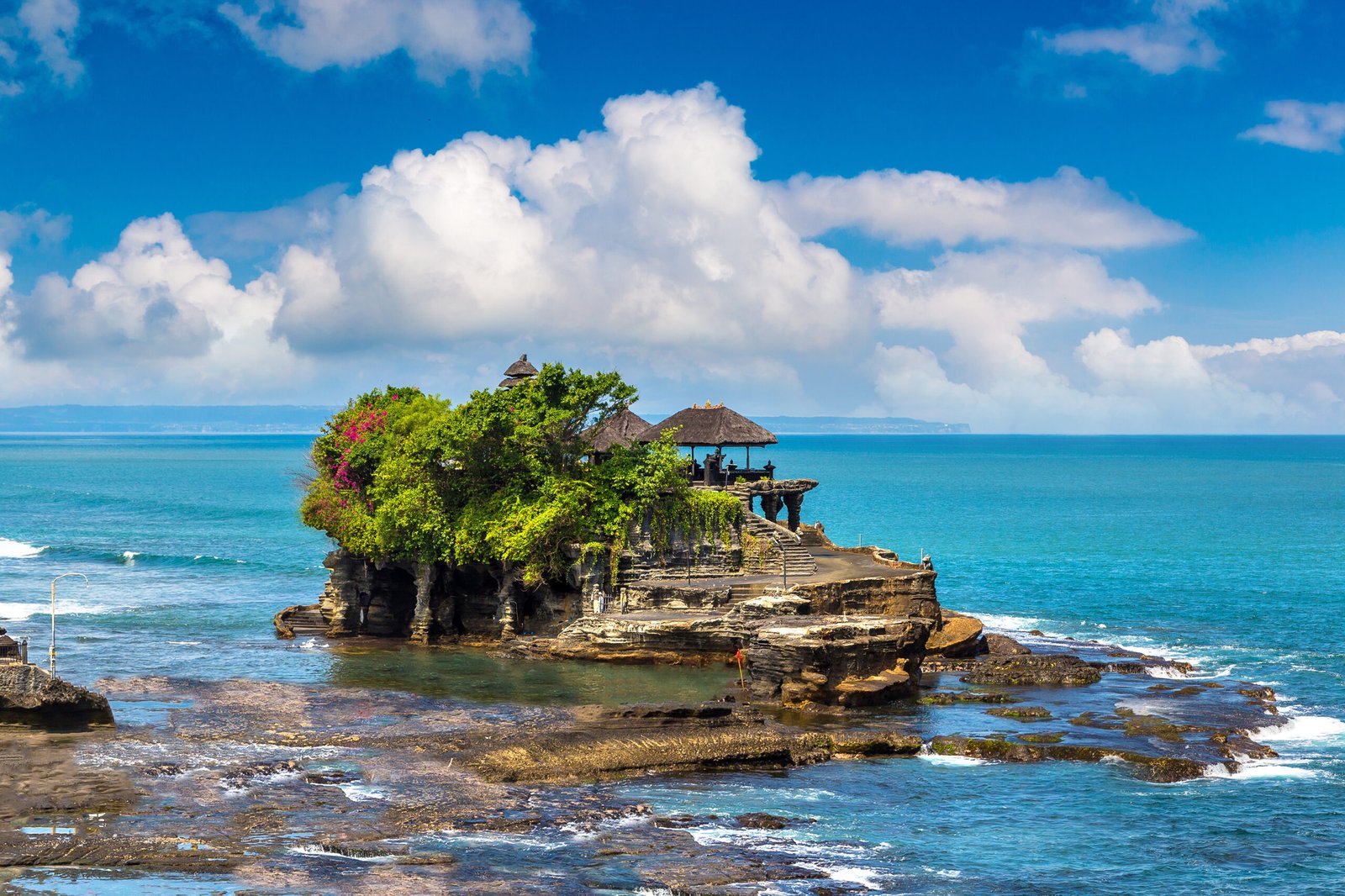 Panoramic view of Tanah Lot temple on Bali, Indonesia in a sunny day